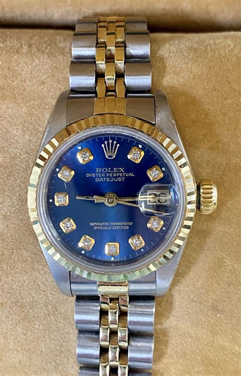 ladies rolex blue face diamonds.